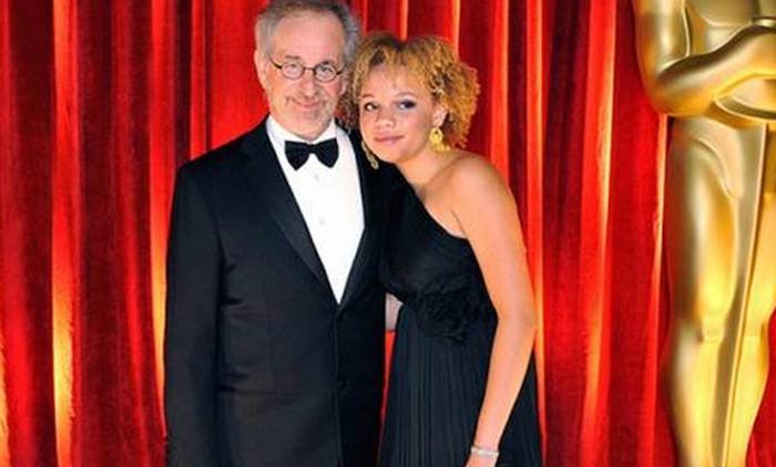 Steven Spielberg’s adopted daughter has launched a new career as an adult entertainer and says her father is "intrigued" with her choice.