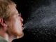 People who deliberately cough in public could face terrorism charges, DOJ warn