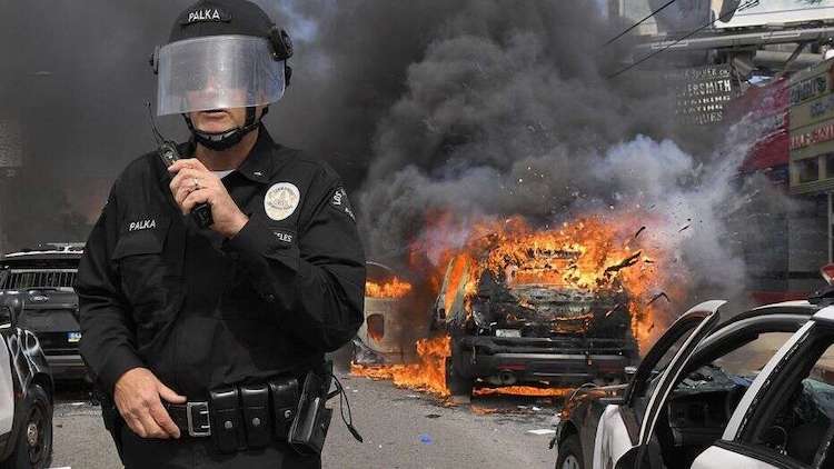 As American cities continue to deal with the ongoing attacks by violent leftists, dozens of anti-American corporations from around the world are collectively donating millions of dollars to far-left organizations that are working to defund American police departments, according to a new report.