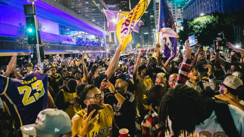 LAPD car attacked by maskless Lakers fans outside Staples Center
