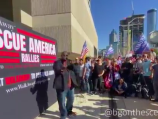 Large crowds gather outside CNN HQ in Atlanta chanting 'CNN sucks'