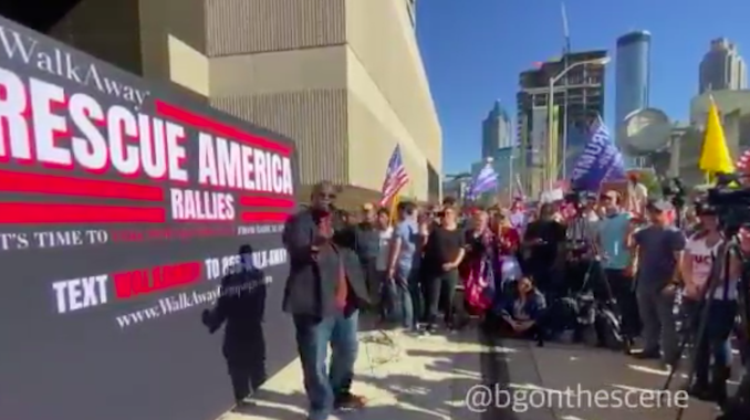 Large crowds gather outside CNN HQ in Atlanta chanting 'CNN sucks'