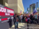 Large crowds gather outside CNN HQ in Atlanta chanting 'CNN sucks'