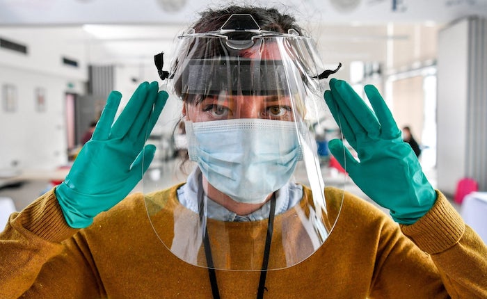 Experts want Americans to wear three masks