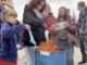 Families burn masks outside state Capitol