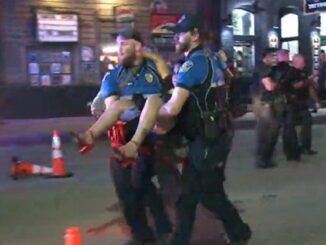 One of two suspects has been arrested over a mass shooting in downtown Austin that left 14 people injured during a night out in the Austin's entertainment district.