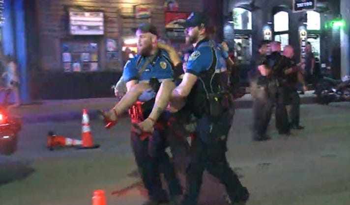 One of two suspects has been arrested over a mass shooting in downtown Austin that left 14 people injured during a night out in the Austin's entertainment district.