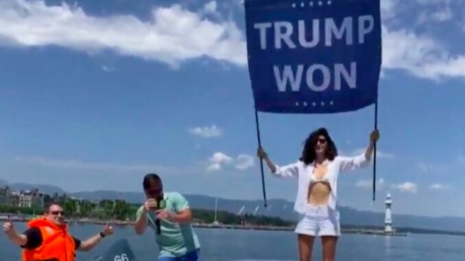 Osama bin Laden's niece unveils 'Trump won' banner outside Biden-Putin summit