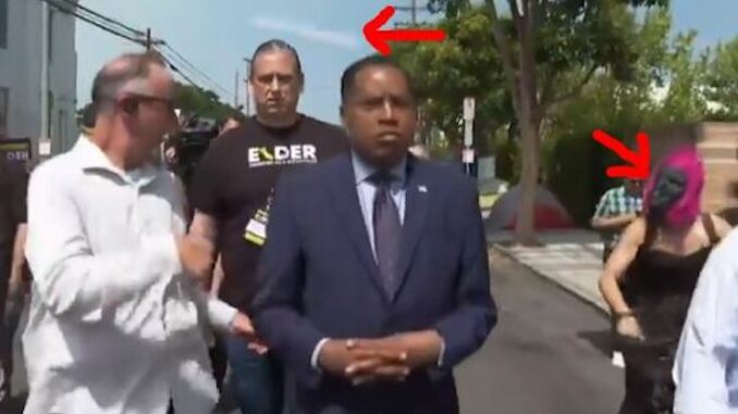 Democrat wearing a gorilla mask physically assaults Larry Elder