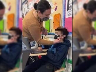 Parents horrified after Democrat teacher photographed taping a mask to a young child's face
