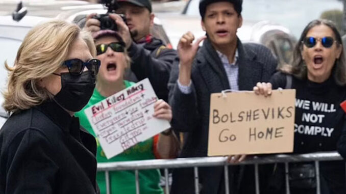 Crown chant 'lock her up' to Hillary Clinton's face in NYC