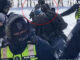 Justin Trudeau's goons caught beating a protestors with the back of a rifle