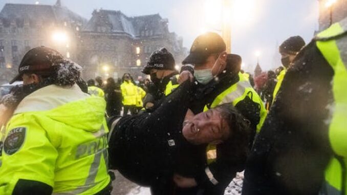 Justin Trudeau's troops begin smashing car windows and dragging out protestors