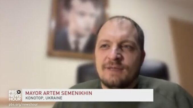 PBS caught promoting neo-nazi Ukraine mayor while blurring image of Hitler associate behind him