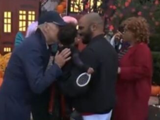 Joe Biden creeps on another child during Halloween celebrations