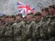 British WEF leader deploys 20,000 military troops to Russian border.