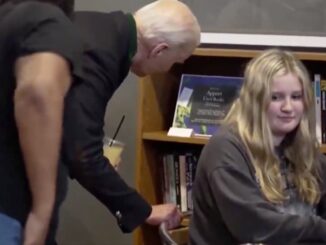 Underage girl recoils in horror as Biden gropes her and whispers something nasty in her ear.