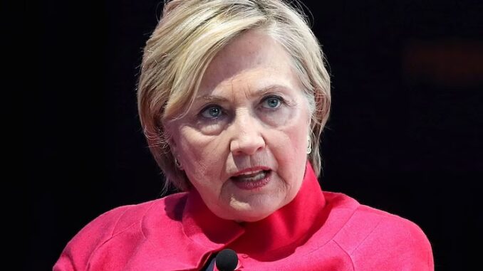 Hillary Clinton trembles with fear as crowd chant 'war criminal' to her face