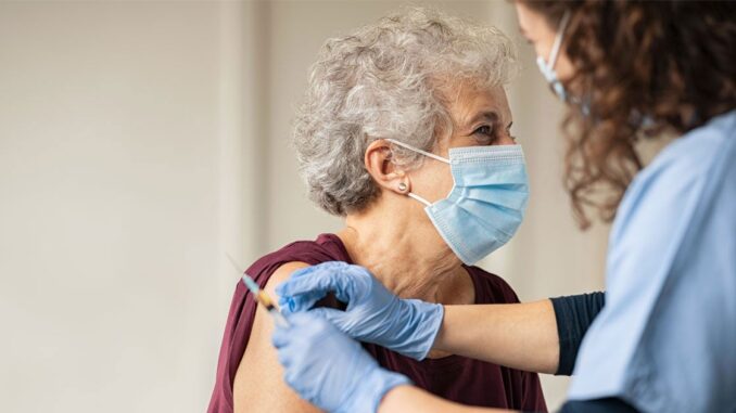 woman having covid jab