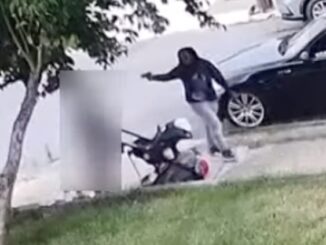 Black woman shoots baby in stroller.