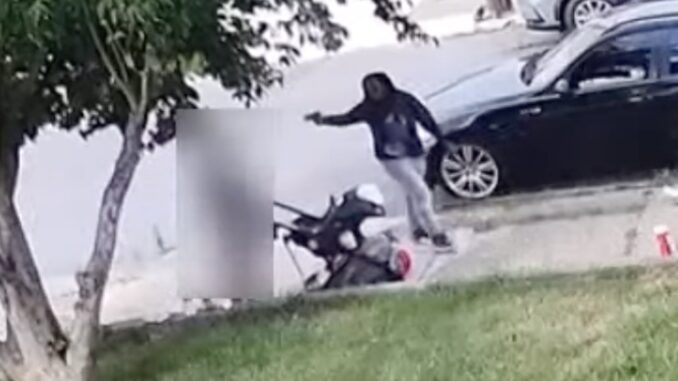 Black woman shoots baby in stroller.