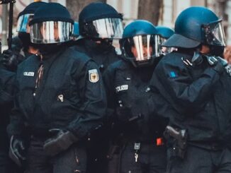 German police raid elderly man's home for retweeting meme on X.