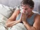 flu man sneezes