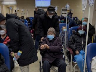 China's hospitals overwhelmed with 'sudden' pneumonia patients.