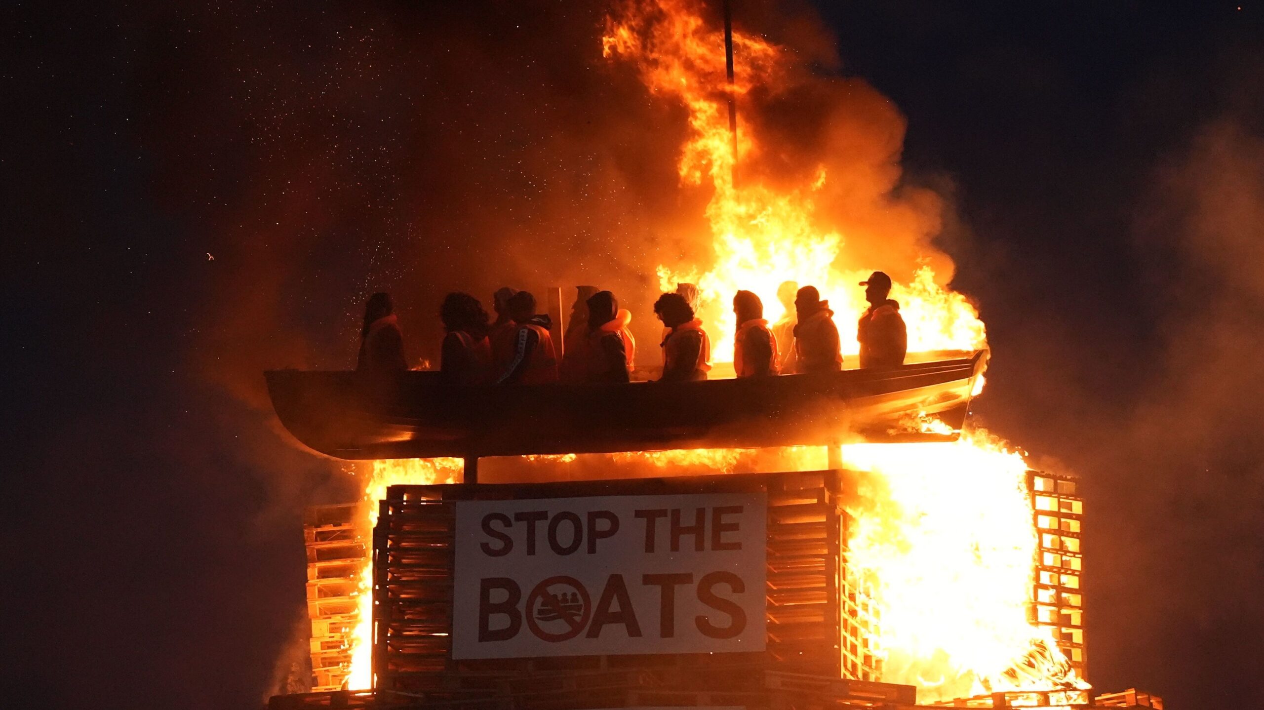 Police Investigate Burning of Migrant-Boat Effigy In Northern Ireland