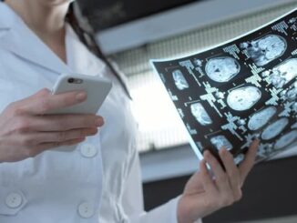 Scientists accuse WHO of covering up cell phone cancer dangers.