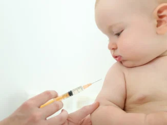 child having vaccination