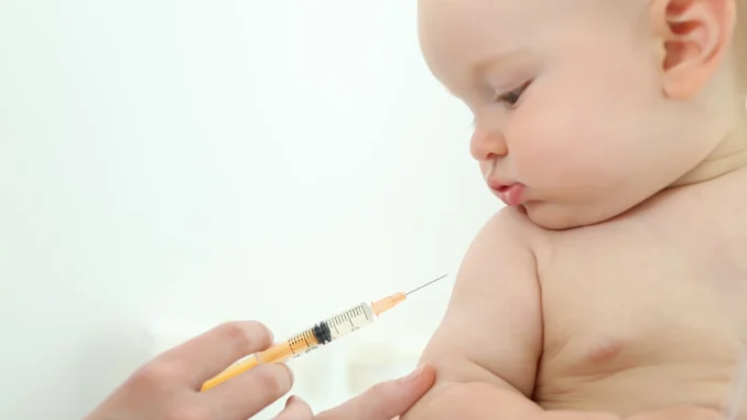 child having vaccination